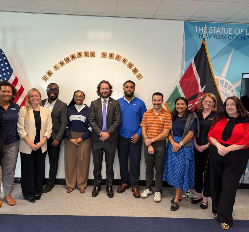 SEED colleagues at the US Embassy in Nairobi, in front of the US and Kenyan flags